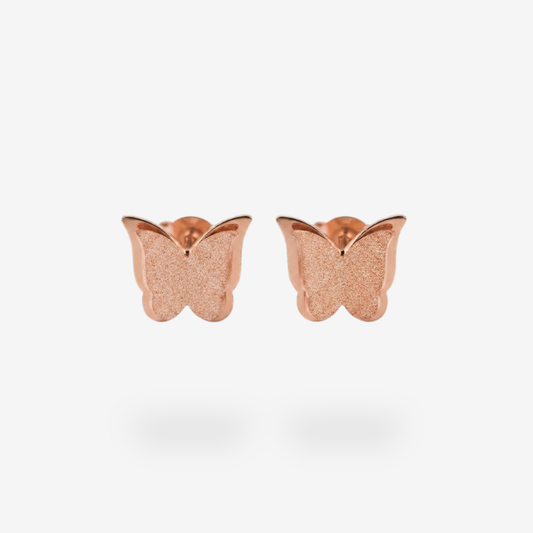 Pendiente de titanio de oro rosa con diseño de mariposa brillante